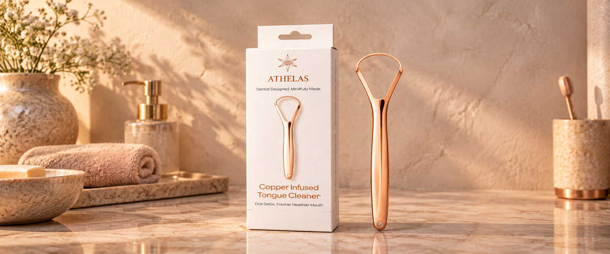Athelas copper infused tongue cleaner beside its packaging